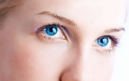 A woman's blue eyes after blepharoplasty surgery