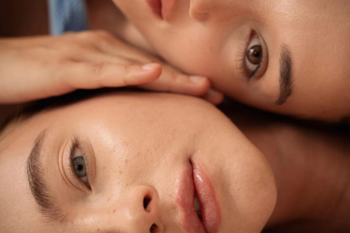 two beautiful woman with their heads on one another two beautiful woman with their heads on one another